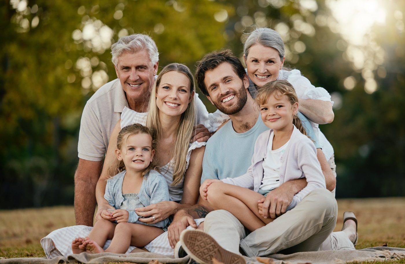 Multi-generation family together outdoors